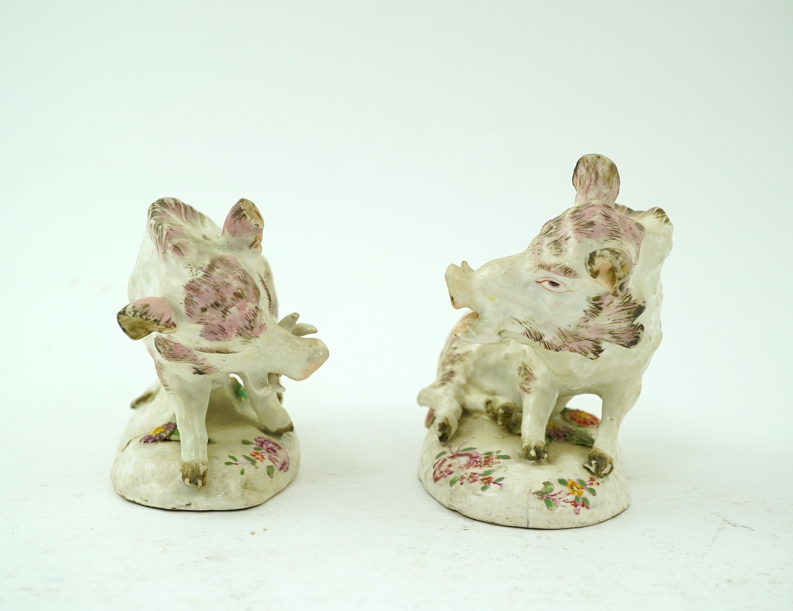 A pair of early Derby porcelain models of wild boars, c.1752-55